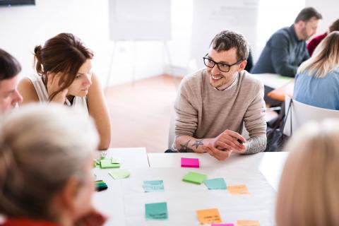 People talking at a desk